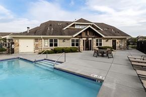 Greenfield apartment for rent - A house with a pool in the backyard.