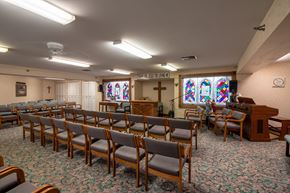 Hales Corners apartment for rent - a church with chairs and a piano and a stained glass window