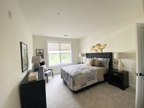 Brookfield apartment for rent - a bedroom with a large bed and a window