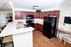Oak Creek apartment for rent - a kitchen with black appliances and a white counter top