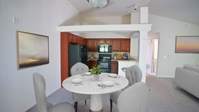 Greenfield apartment for rent - a kitchen and dining room with a white table and chairs