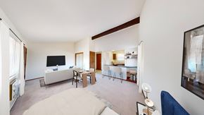 West Allis apartment for rent - a living room and dining room with a couch and a table