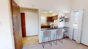 West Allis apartment for rent - a kitchen with a counter and two stools