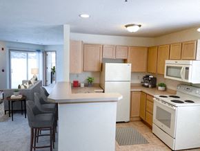 New Berlin apartment for rent - a kitchen with white appliances and a counter top