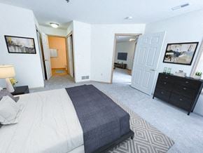 New Berlin apartment for rent - a bedroom with a bed and a closet