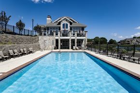 Menomonee Falls apartment for rent - a pool with a house in the background