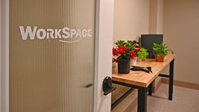 Brookfield apartment for rent - a door with the words workspace on it and a table with plants on it