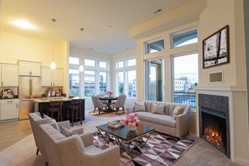 Brookfield apartment for rent - a living room with a couch table and chairs and a fireplace