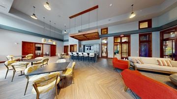 Brookfield apartment for rent - A modern living room with a long wooden table and chairs.