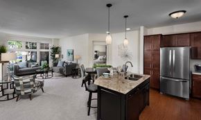 Menomonee Falls apartment for rent - a kitchen and living room with a refrigerator