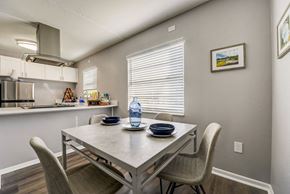 Tampa apartment for rent - a dining area with a table and chairs and a kitchen