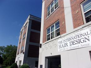 Buffalo apartment for rent - A building with a sign that says "The International Hair Design" on it.
