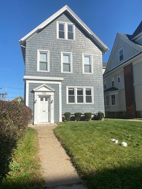 Buffalo apartment for rent - A house with a white door and windows.