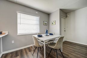 Tampa apartment for rent - our redesigned dining room with a table and chairs and a window