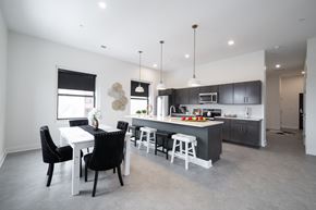 Buffalo apartment for rent - A modern kitchen with a dining table and chairs.at The Annex Apartment, New York, 14222