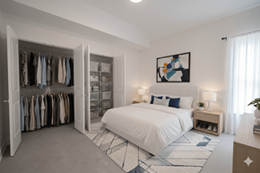 Buffalo apartment for rent - A bedroom with a large bed and a wardrobe.