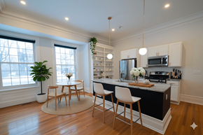 Buffalo apartment for rent - A kitchen with a table and chairs in the middle of the room.
