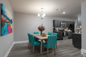 Cocoa apartment for rent - A dining room with a table set for four.
