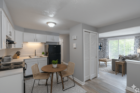 Hamburg apartment for rent - A kitchen with a table and chairs in the middle of the room.