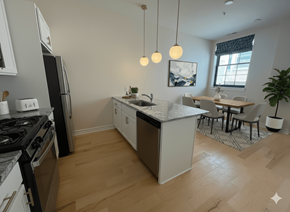 Buffalo apartment for rent - A kitchen with a black stove top oven and a black refrigerator.