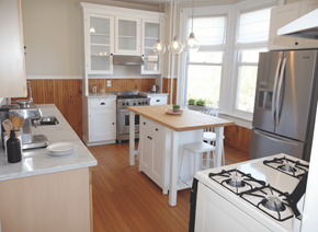Buffalo apartment for rent - A kitchen with white appliances and wooden floors.