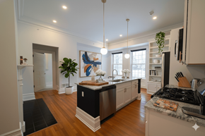 Buffalo apartment for rent - A modern kitchen with a black and white island.