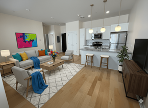 Buffalo apartment for rent - A modern living room with a kitchen in the background.