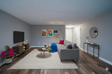 Hamburg apartment for rent - A living room with a grey couch, a coffee table, a TV, and a painting on the wall.