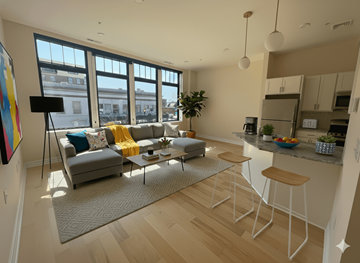 Buffalo apartment for rent - A living room with a grey couch and a coffee table.
