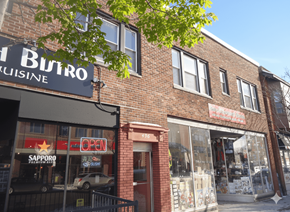 Buffalo apartment for rent - A brick building with a sign that says Butro Kuisine.