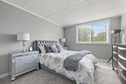 Woodridge apartment for rent - Renovated Bedroom with window view at Woodland Ridge Apartments in Woodridge, IL
