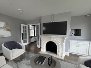 Buffalo apartment for rent - A living room with a fireplace and a television.