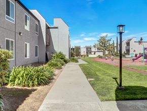 Fullerton apartment for rent - A residential area with a sidewalk and a playground.