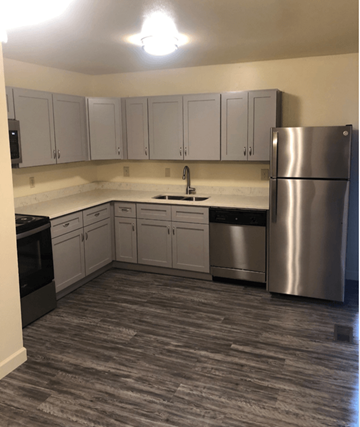 Centerville apartment for rent - a kitchen with stainless steel appliances and white cabinets
