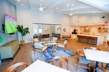 Lisle apartment for rent - a large living room with tables and chairs