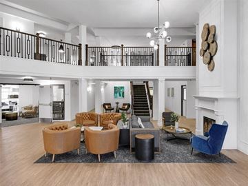 Plymouth apartment for rent - a living room with couches and chairs and a staircase