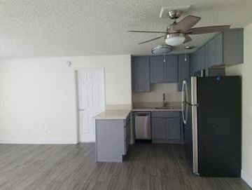 Portland apartment for rent - a kitchen with a refrigerator and a ceiling fan
