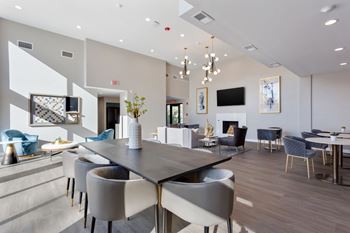 Clubhouse and community room with fireplace, flat screen tv and solarium