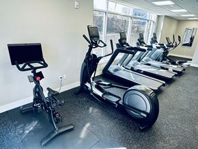 Milford apartment for rent - A gym with treadmills and exercise bikes.