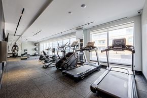 Newmarket apartment for rent - A gym with treadmills and other exercise equipment.