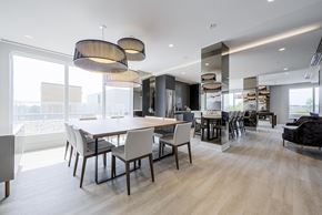 Newmarket apartment for rent - A modern dining room with a large table and chairs.