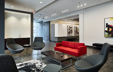 Calgary apartment for rent - A living room with a red couch and grey chairs.