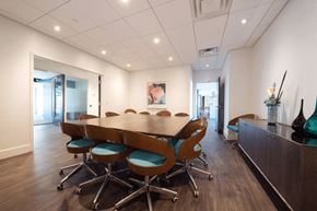 Calgary apartment for rent - A conference room with a long table and chairs.