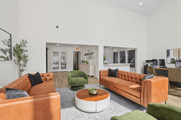 Decatur townhouse for rent - A living room with orange couches and green chairs.
