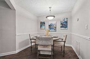 Atlanta apartment for rent - A dining room with a table set for two.
