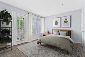 Decatur apartment for rent - a bedroom with a bed and two windows