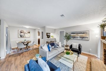 Stone Mountain apartment for rent - A living room with a white couch and a glass coffee table.