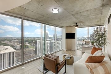 Atlanta apartment for rent - a living room with a white couch and a large window
