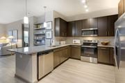 Atlanta apartment for rent - a kitchen with a large center island with a granite countertop