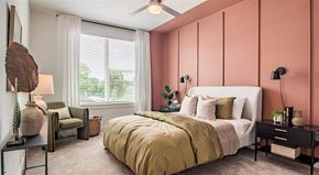 Duluth apartment for rent - a bedroom with pink walls and a bed